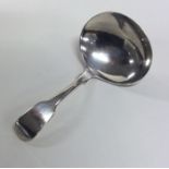 A George III silver caddy spoon of oval plain form