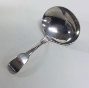 A George III silver caddy spoon of oval plain form