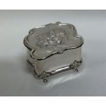 An Edwardian silver hinged top box attractively de