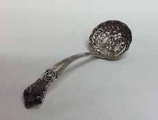 An attractive silver sifter spoon with floral deco