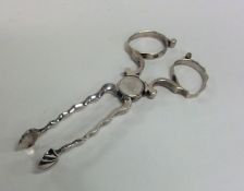 A good pair of Georgian silver sugar scissors with