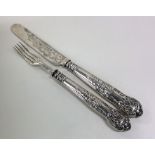 A Victorian silver christening knife and fork. She