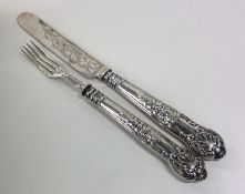 A Victorian silver christening knife and fork. She