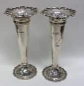 A good pair of cast silver spill vases with pierce