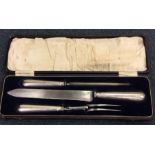 A cased silver handled three piece carving set. Sh