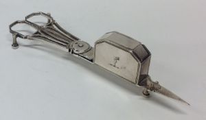 A good pair of Georgian crested silver candle snuf