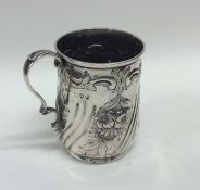 An Edwardian embossed silver christening mug with