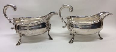 A good pair of Georgian silver sauceboats with cre