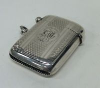 A heavy engine turned silver vesta case with hinge