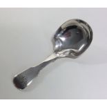 A shaped silver fiddle pattern caddy spoon. Birmin