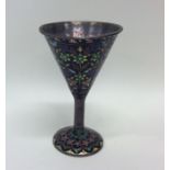 A silver and enamelled goblet decorated in bright