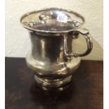 A Georgian silver christening cup on spreading bas