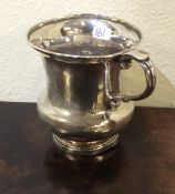 A Georgian silver christening cup on spreading bas