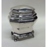 An Edwardian silver tea caddy of shaped form with