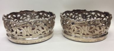 A good pair of pierced silver wine coasters profus