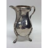 An 18th Century Continental silver jug on three ha