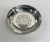 An attractive circular silver pin dish with engrav