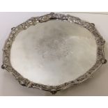 A large Georgian silver salver with crested centre