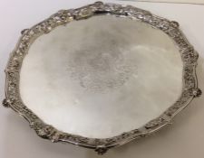 A large Georgian silver salver with crested centre