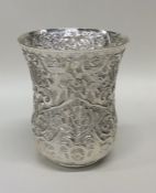 A Turkish silver beaker profusely decorated with f