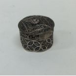 An 18th Century silver filigree box with lift-off