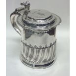 A rare lady's Queen Anne silver lidded tankard of