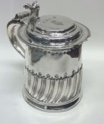 A rare lady's Queen Anne silver lidded tankard of