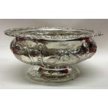 A heavy Georgian silver sugar bowl profusely decor