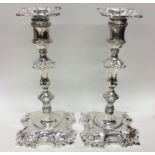 A good pair of cast silver candlesticks of typical