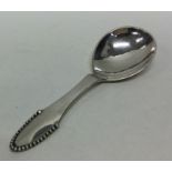 GEORG JENSEN: A stylish silver caddy spoon of text