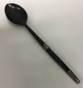 A large silver and tortoiseshell mounted spoon wit