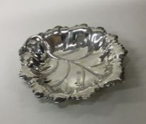 A novelty silver pin dish in the form of a leaf. B
