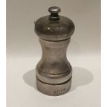 A 20th Century silver pepper grinder of typical fo