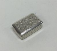 An attractive chased silver vinaigrette with hinge
