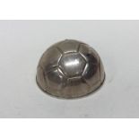 An unusual silver paperweight in the form of a foo