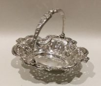 An Edwardian silver swing handled basket of shaped