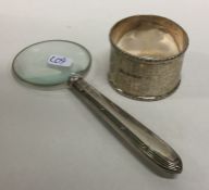 A silver engine turned napkin ring together with a