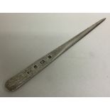 A heavy silver tapering letter opener. London 1987