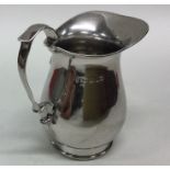 A good heavy Edwardian silver cream jug with shape
