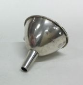 A small Victorian silver wine funnel with gilt int