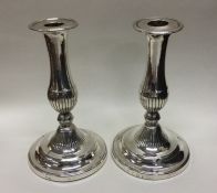A good pair of circular George III silver candlest