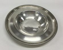 A George III silver dish with gadroon rim. London