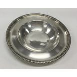 A George III silver dish with gadroon rim. London