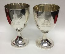 A pair of George III silver goblets with reeded de