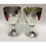 A pair of George III silver goblets with reeded de