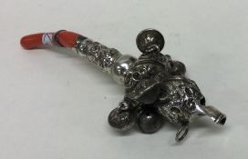 A large silver child's rattle / whistle mounted wi