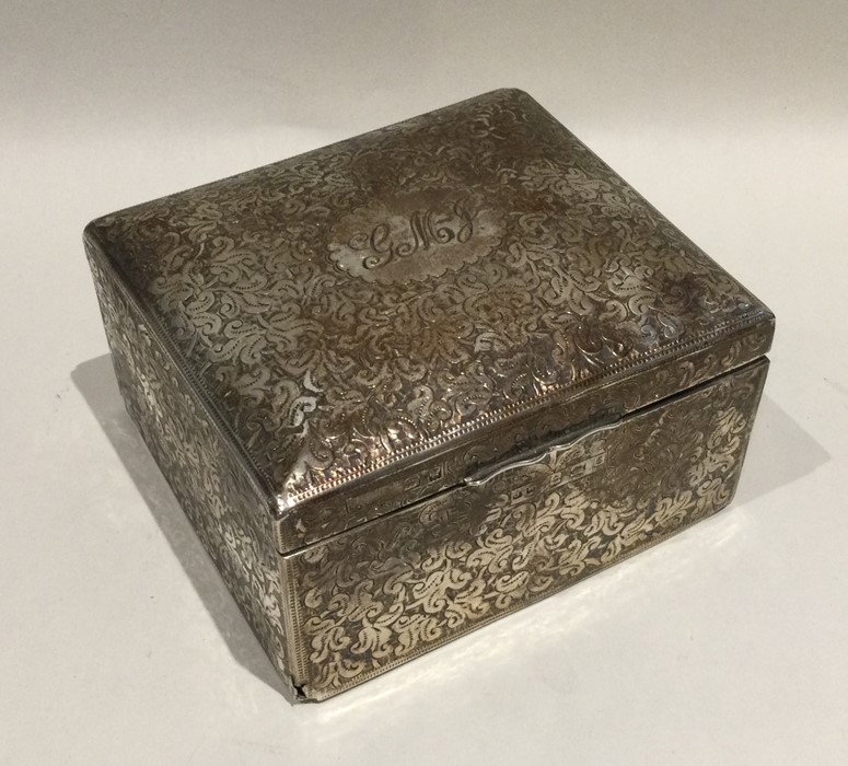 An attractive engraved silver cigarette box decora