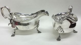 A heavy pair of large George III silver sauce boat