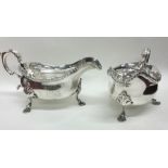 A heavy pair of large George III silver sauce boat