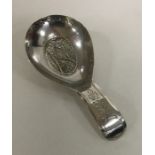 A heavy unusual bright sut silver caddy spoon with